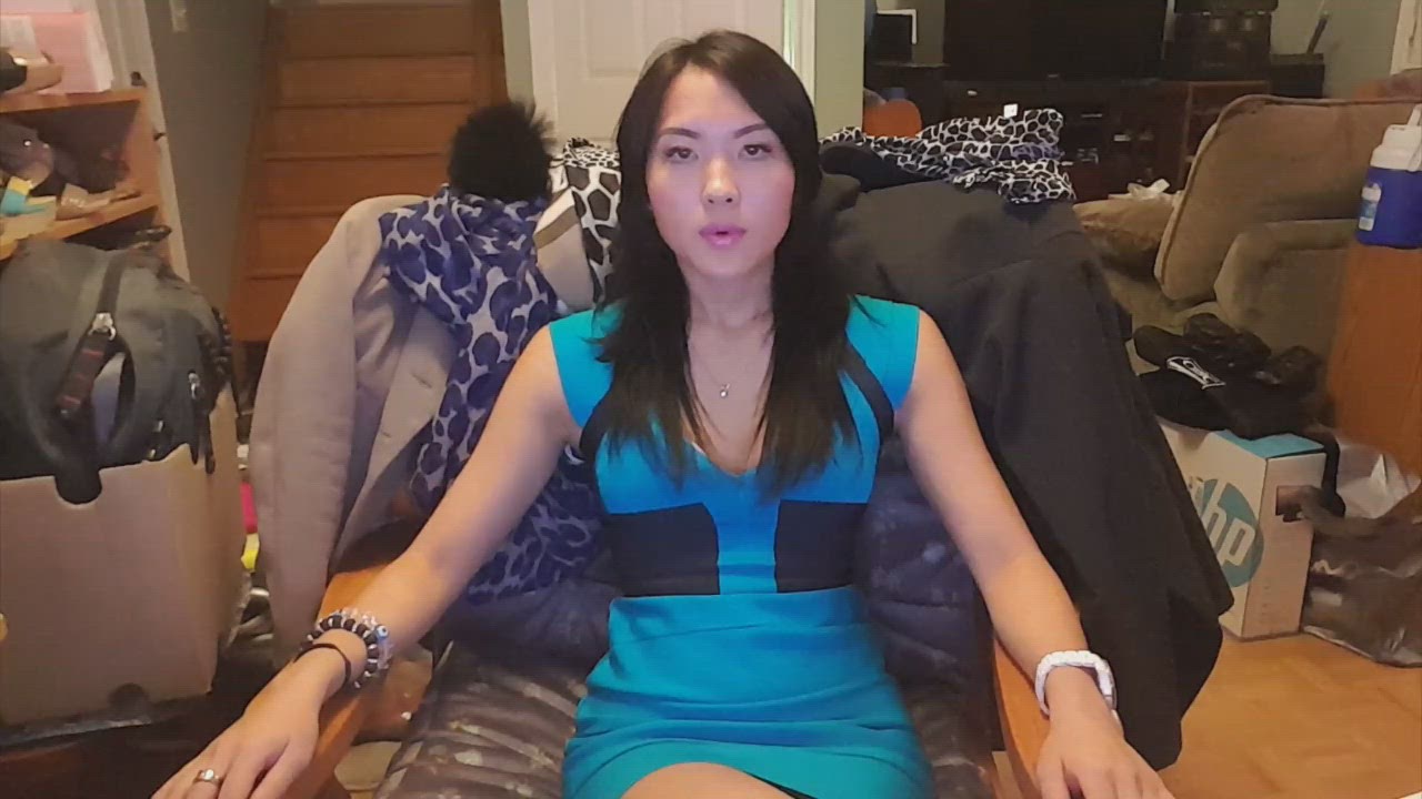1:06 thumbnail from "hypnosis_induction.mp4". Bianca sits calmly, dressed in a blue and black outfit, during the initial phase of hypnotic induction.