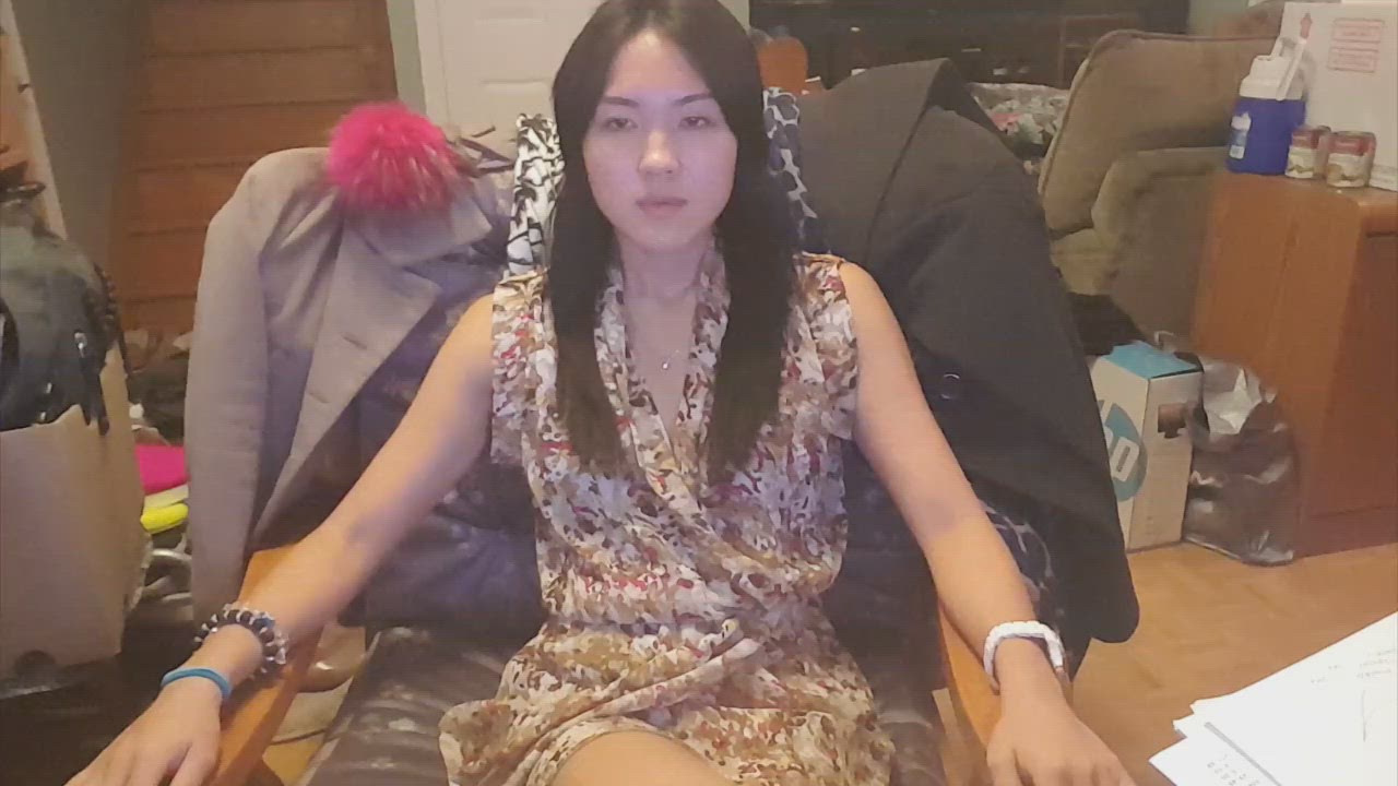 1:19 thumbnail from "suggestibiliity_tests.mp4". Bianca demonstrates the eyelid test, a key hypnotizability assessment, where the participant attempts to roll their eyes upwards while simultaneously lowering their eyelids.