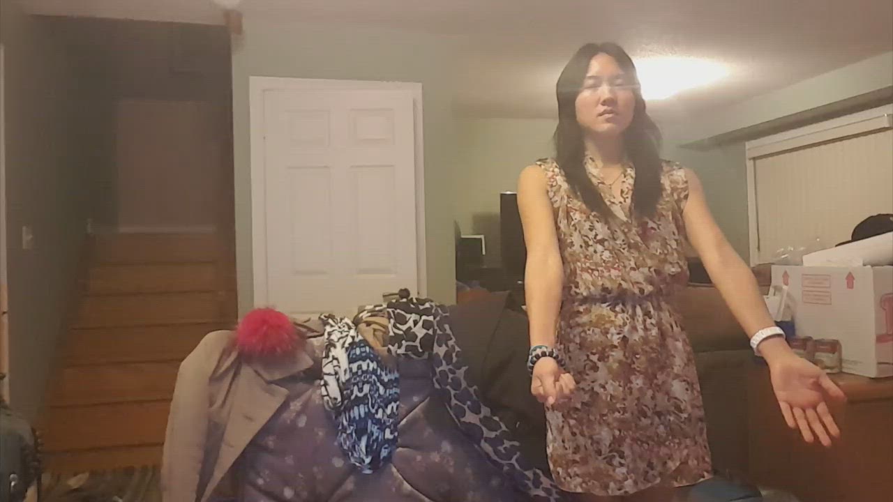 5:02 thumbnail from "suggestibiliity_tests.mp4". Bianca demonstrates the "opposing arms test" during a hypnosis session.